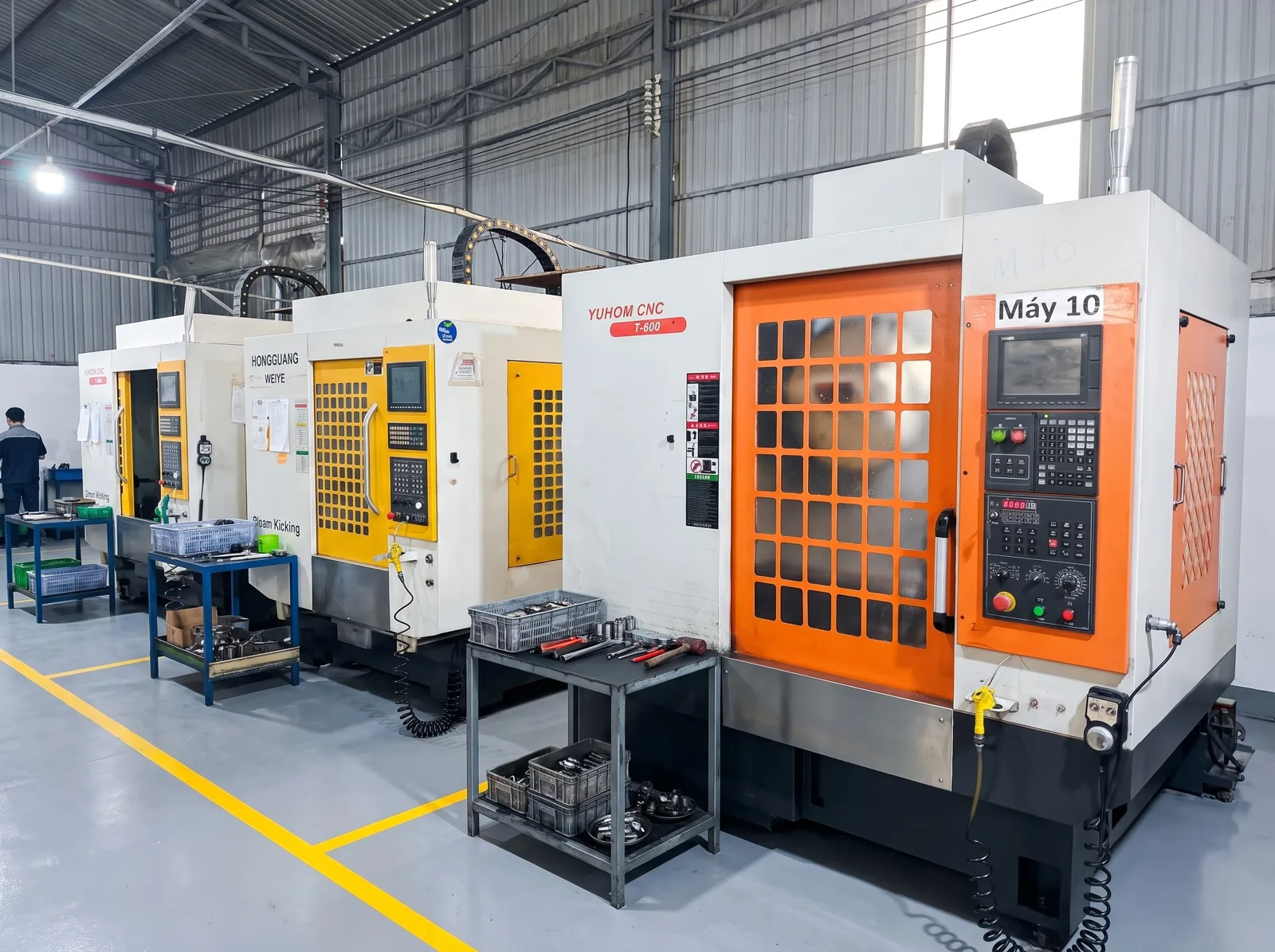 A bank of vertical machining centers on our floor